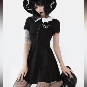 Chic Black and White Mini Dress with Bat Detail